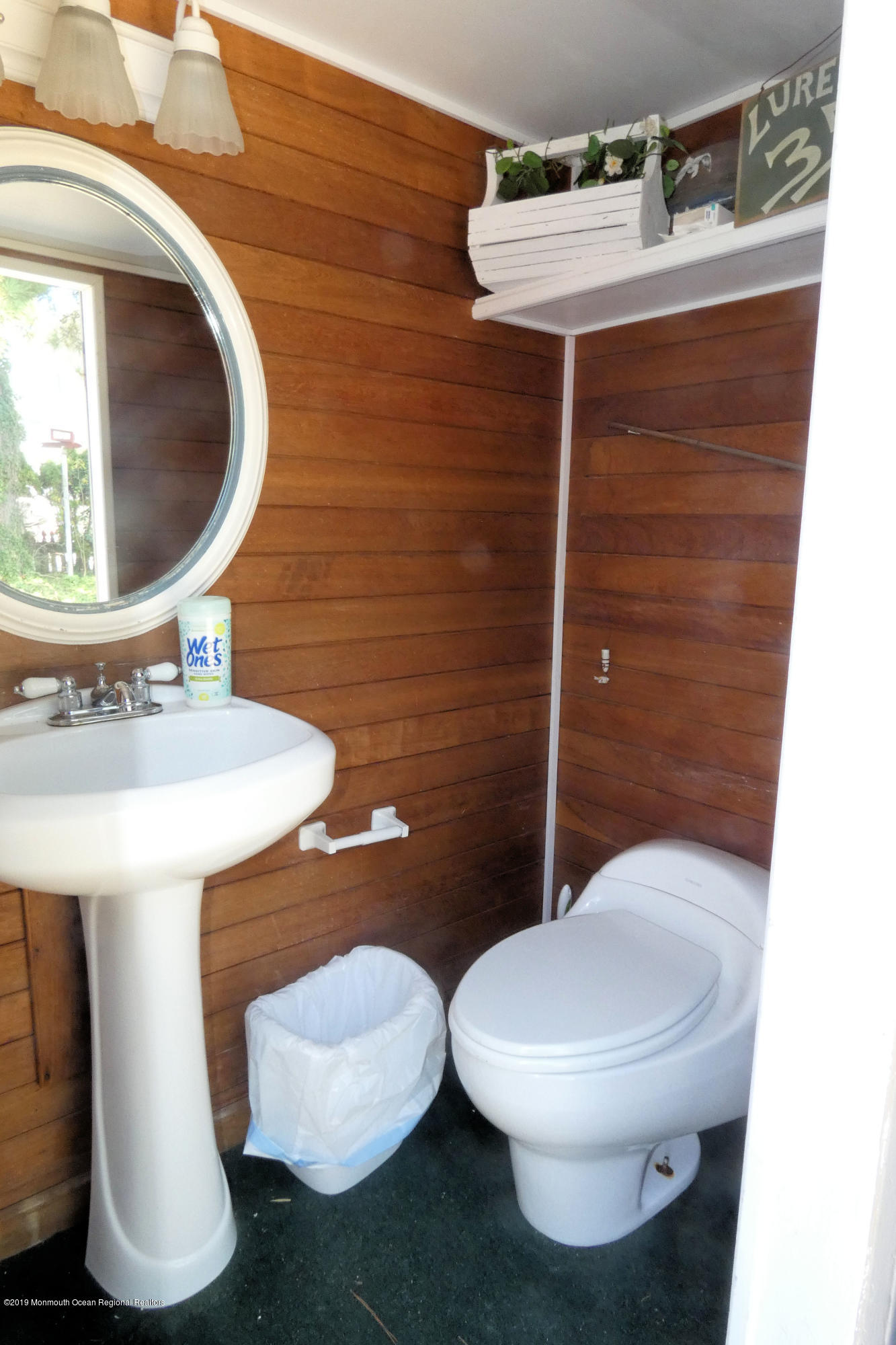 44 Las Vegas Road Lavallette, NJ 08735 - Photo 14 of 18 a bathroom with a toilet sink and mirror