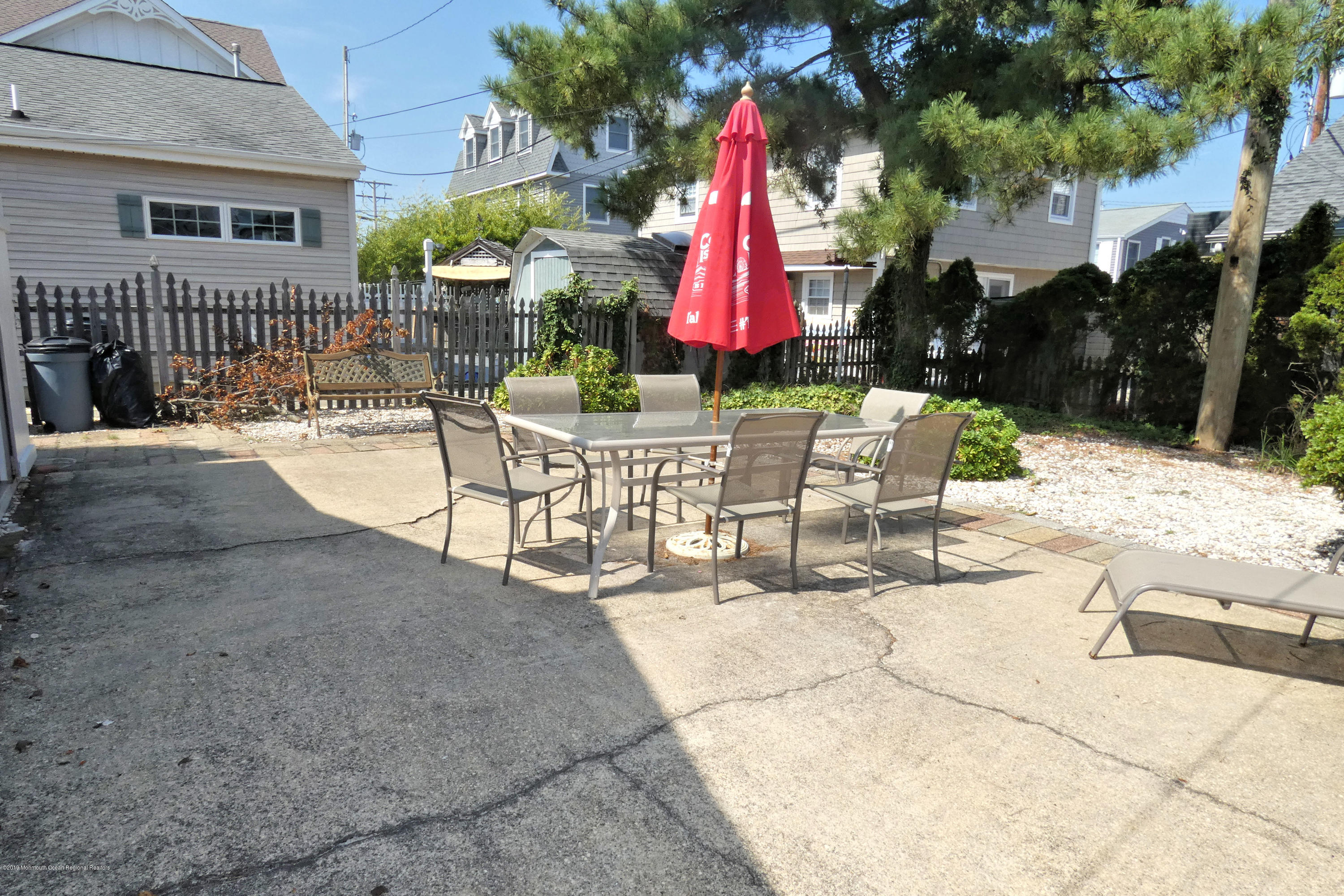44 Las Vegas Road Lavallette, NJ 08735 - Photo 16 of 18 a view of house with backyard and sitting area