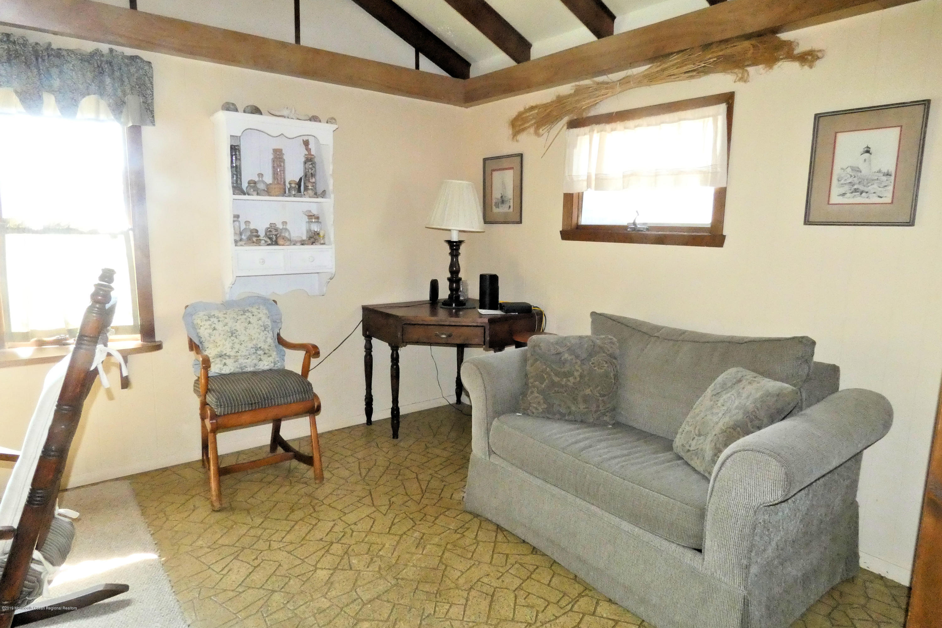 44 Las Vegas Road Lavallette, NJ 08735 - Photo 8 of 18 a living room with furniture and a large window