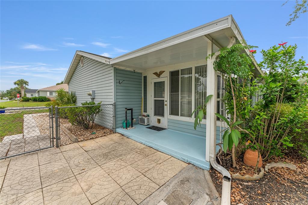 9499 Southeast 174th Loop Summerfield, FL 34491 - Photo 11 of 46 a house with garden in front of it