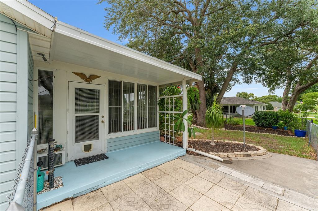 9499 Southeast 174th Loop Summerfield, FL 34491 - Photo 12 of 46 a view of a house with backyard and porch