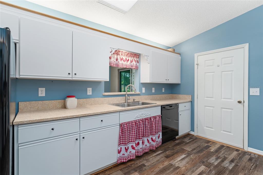 9499 Southeast 174th Loop Summerfield, FL 34491 - Photo 25 of 46 a kitchen with a sink cabinets and window