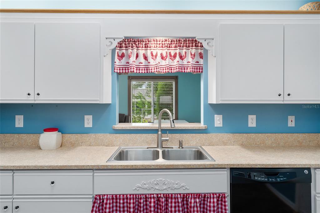 9499 Southeast 174th Loop Summerfield, FL 34491 - Photo 26 of 46 a kitchen with a sink and a stove
