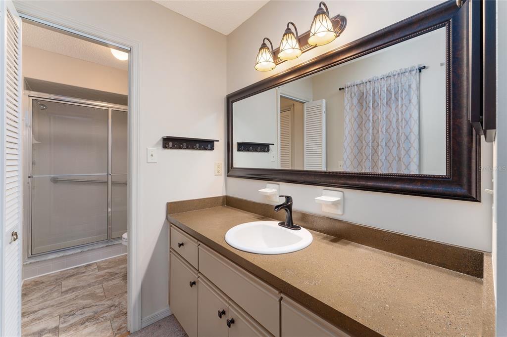 9499 Southeast 174th Loop Summerfield, FL 34491 - Photo 38 of 46 a bathroom with a sink and a mirror