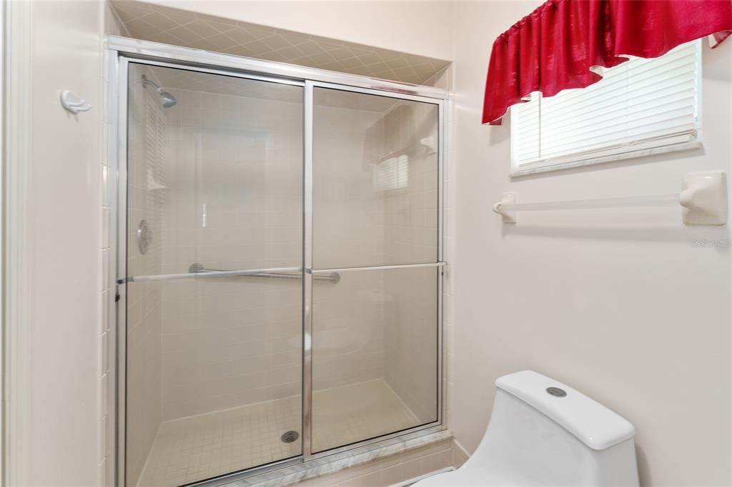 9499 Southeast 174th Loop Summerfield, FL 34491 - Photo 40 of 46 a bathroom with a shower and toilet