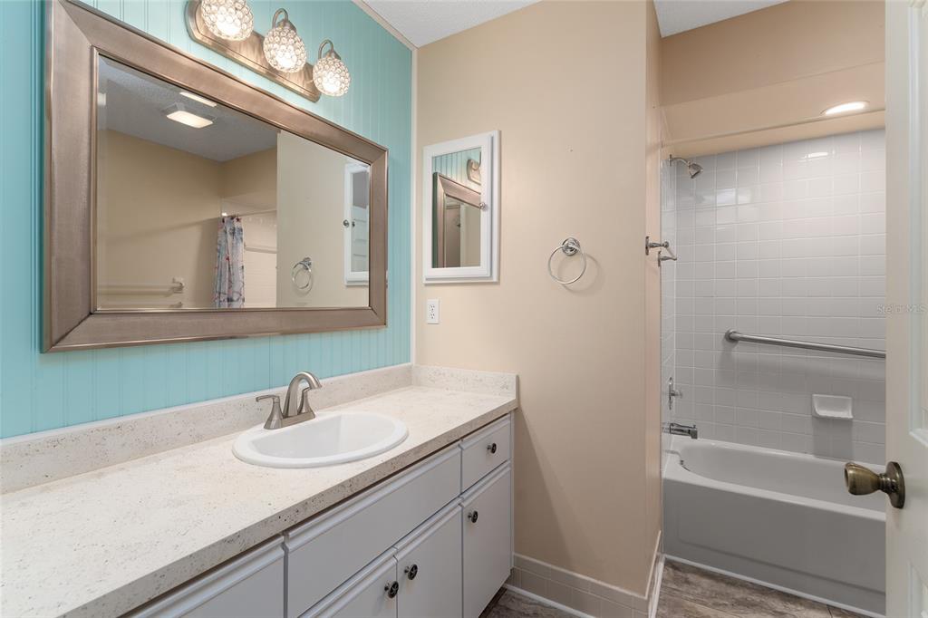 9499 Southeast 174th Loop Summerfield, FL 34491 - Photo 42 of 46 a bathroom with a sink and a mirror