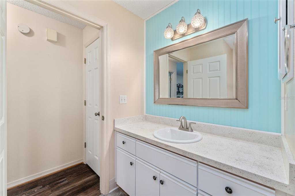 9499 Southeast 174th Loop Summerfield, FL 34491 - Photo 43 of 46 a bathroom with a sink and a mirror