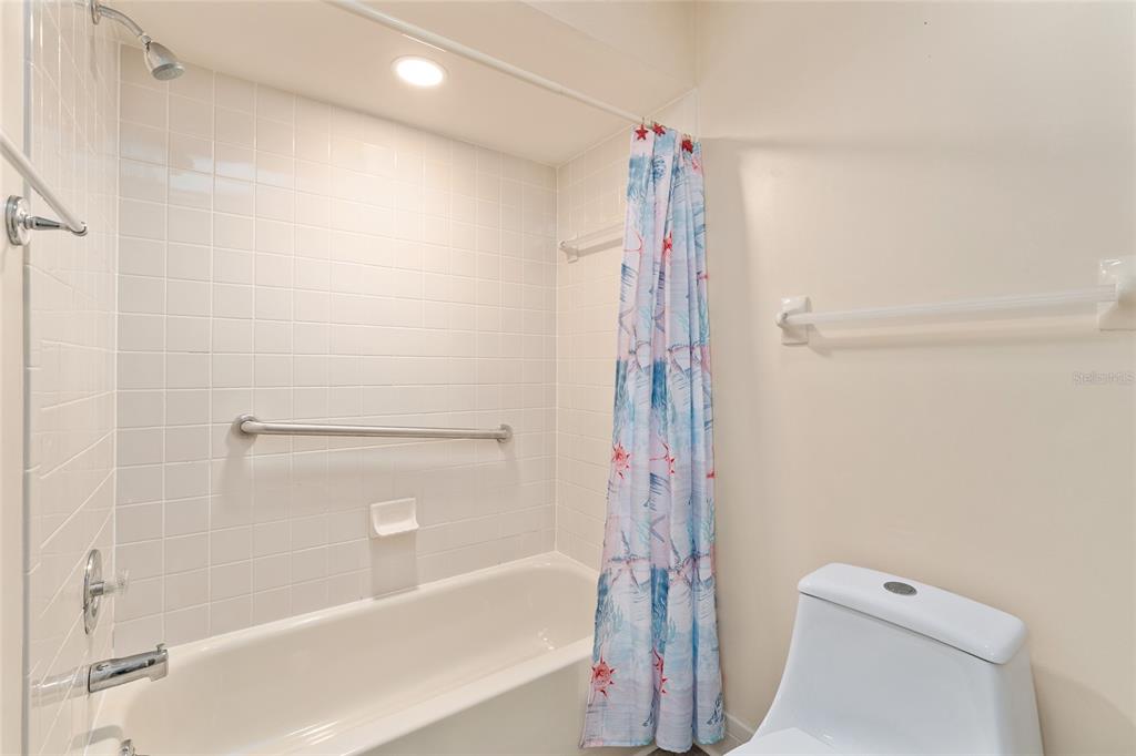 9499 Southeast 174th Loop Summerfield, FL 34491 - Photo 44 of 46 a bathroom with a shower and a toilet