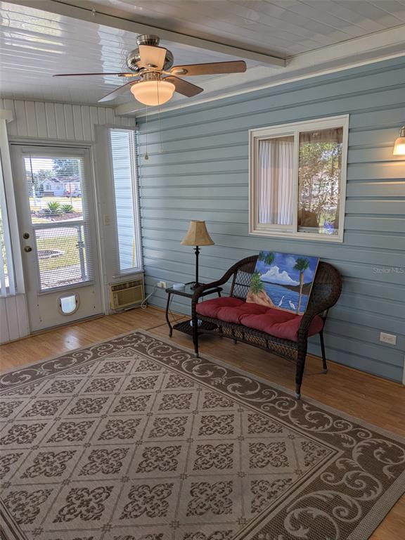 9499 Southeast 174th Loop Summerfield, FL 34491 - Photo 45 of 46 a living room with a rug table and a window