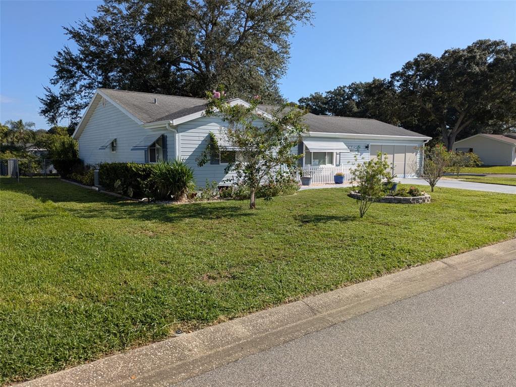 9499 Southeast 174th Loop Summerfield, FL 34491 - Photo 7 of 46 a front view of house with yard and green space