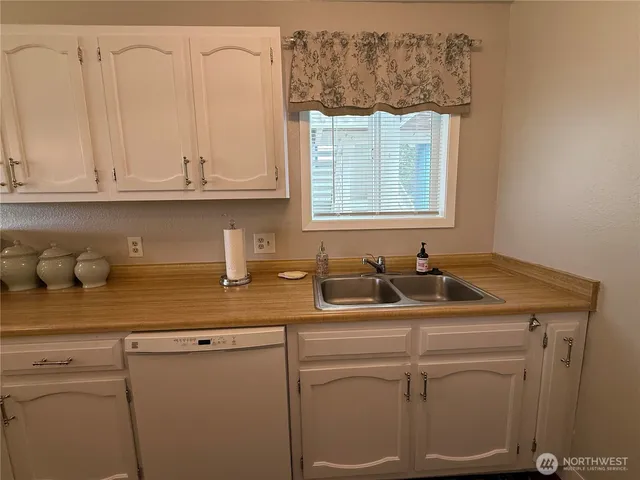 a bathroom with a sink and cabinets