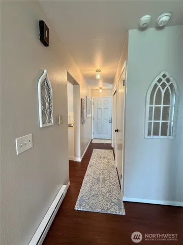 a view of room with window and hardwood floor