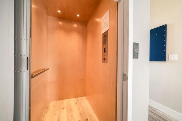 a front view of a building with a yard