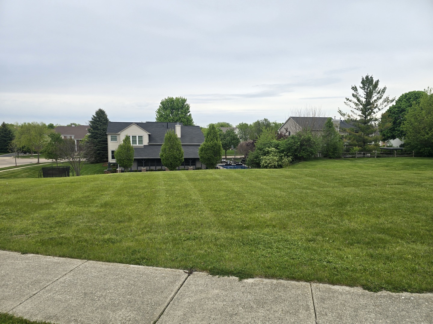 1 Springbrook Lane Algonquin, IL 60102 - Photo 4 of 4 a view of a grassy field with trees