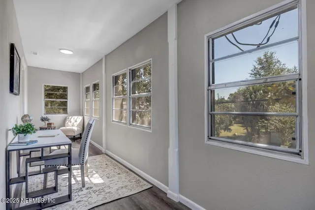 a dining room with furniture and window