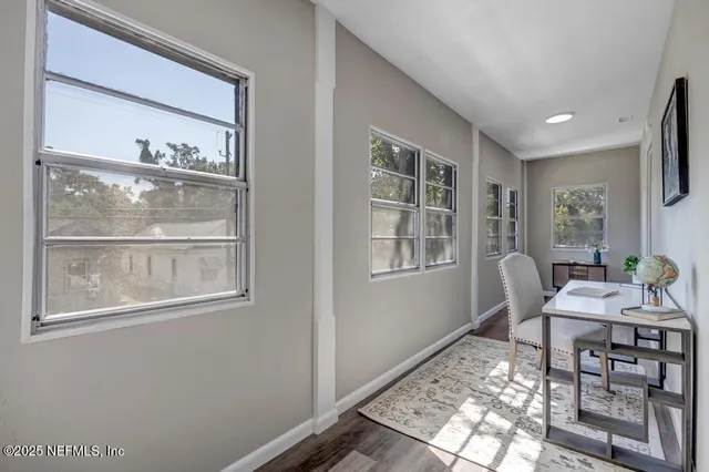 a dining room with furniture and window