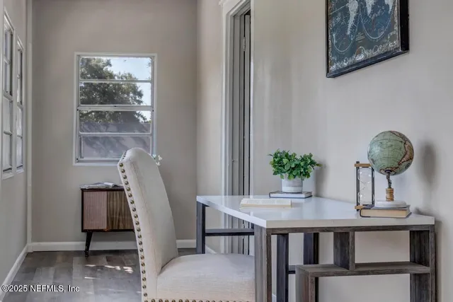 a dining room with furniture and window