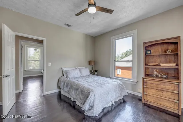 a bedroom with a bed and a view of closet