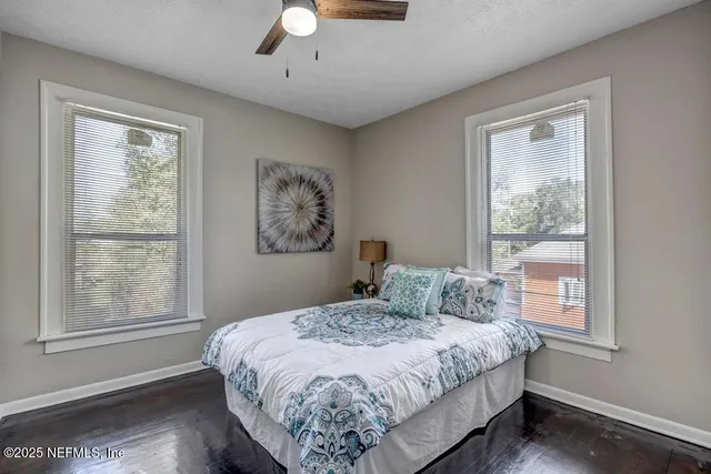 a bedroom with a large bed and a window