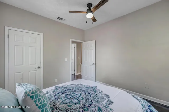 a bedroom with a bed and a dresser