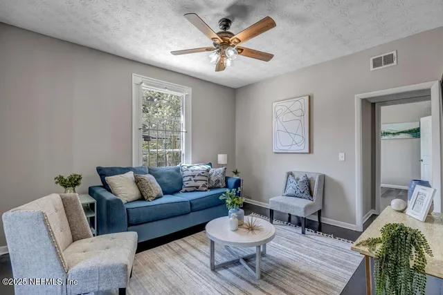 a living room with furniture and a window