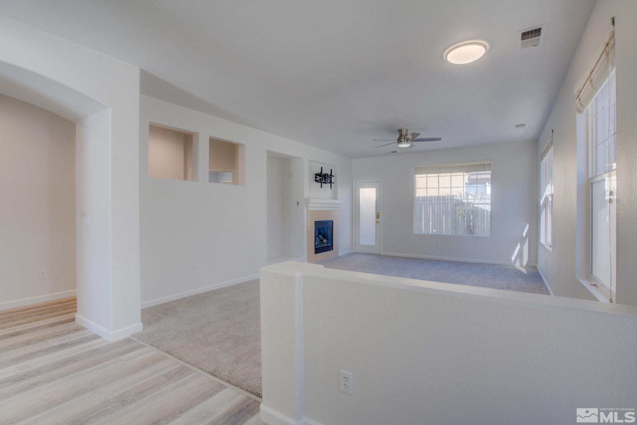 10510 Iron Point Circle Reno, NV 89521 - Photo 5 of 32 wooden floor in an empty room with a window