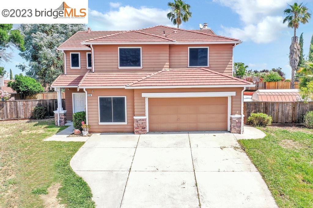 1116 Ridgegate Court Antioch, CA 94531 - Photo 1 of 1 a front view of a house with a yard and garage