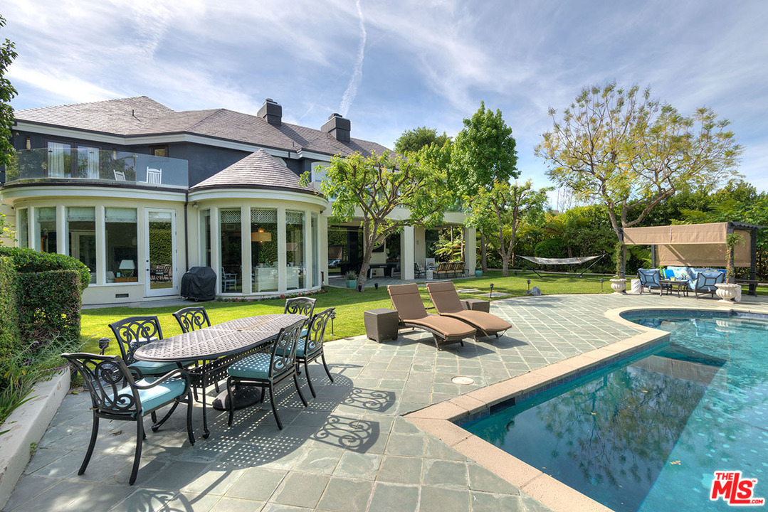 13981 Aubrey Road Beverly Hills, CA 90210 - Photo 11 of 20 swimming pool view with a seating space and a garden view