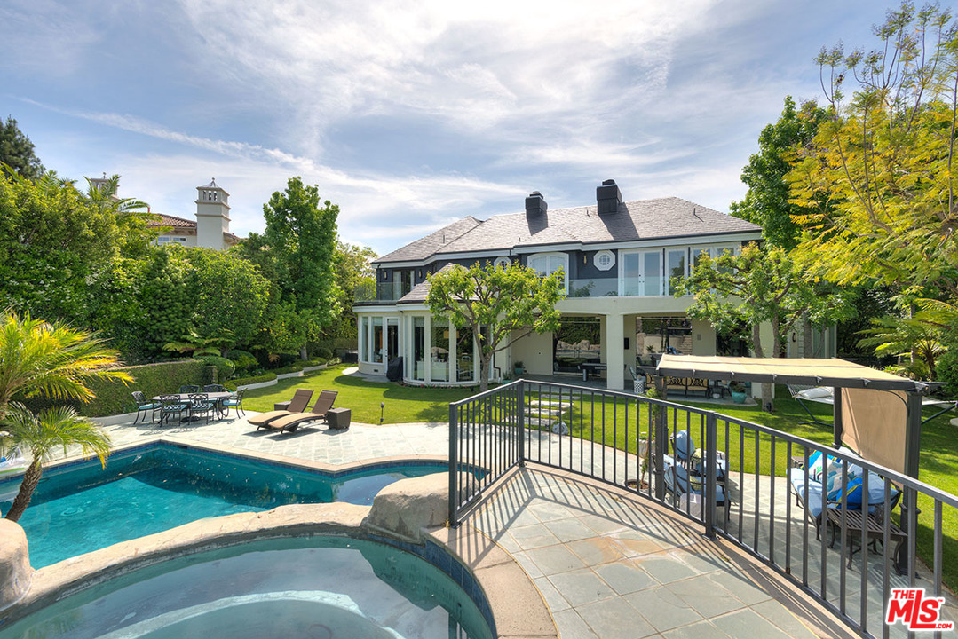 13981 Aubrey Road Beverly Hills, CA 90210 - Photo 13 of 20 a view of a house with pool and chairs