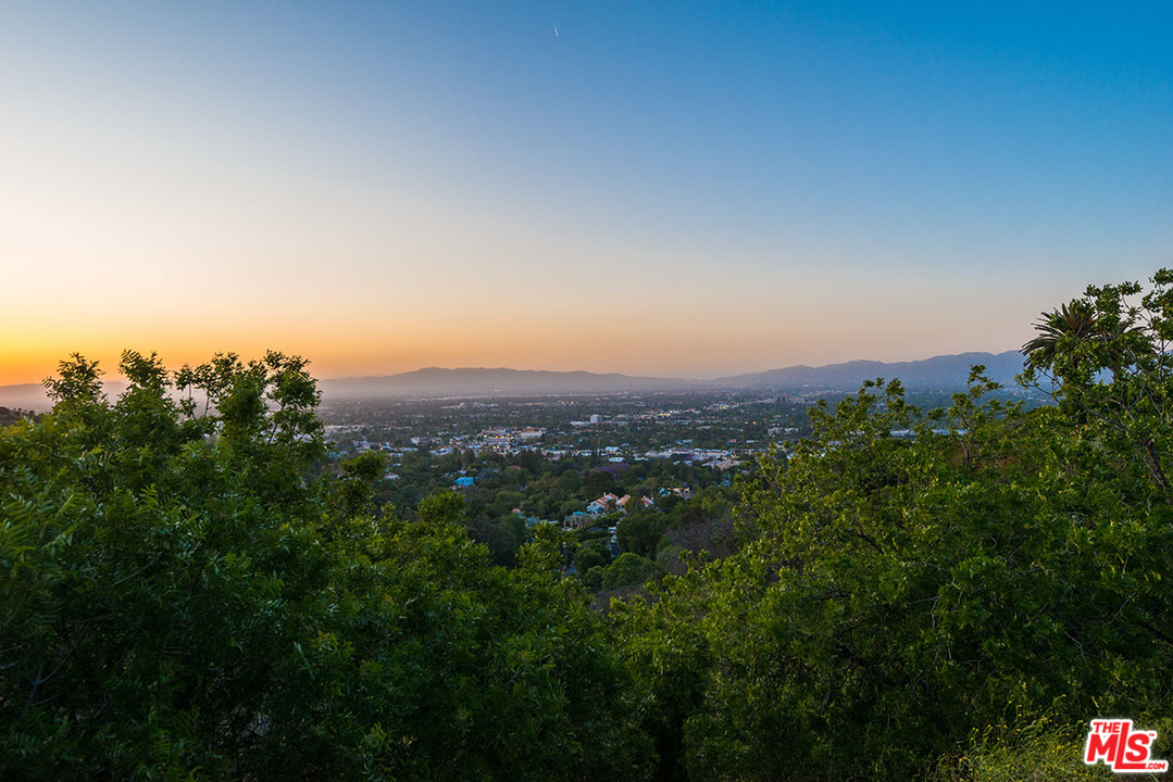 13981 Aubrey Road Beverly Hills, CA 90210 - Photo 19 of 20 a view of a city with lush green forest