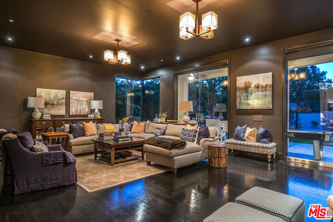 13981 Aubrey Road Beverly Hills, CA 90210 - Photo 7 of 20 a living room with furniture and a flat screen tv
