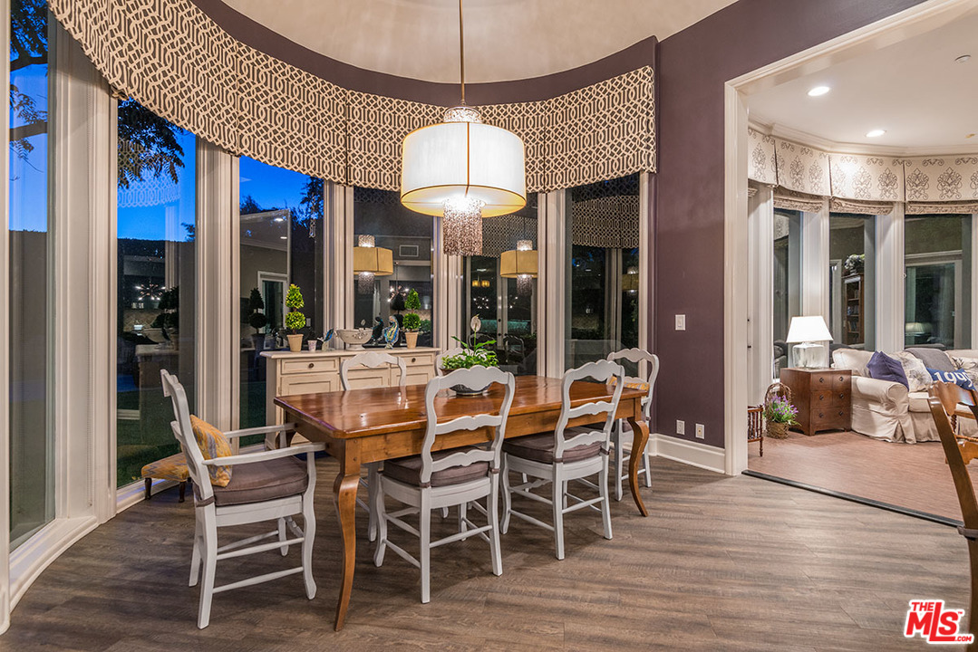 13981 Aubrey Road Beverly Hills, CA 90210 - Photo 9 of 20 a view of a dining room with furniture window and wooden floor