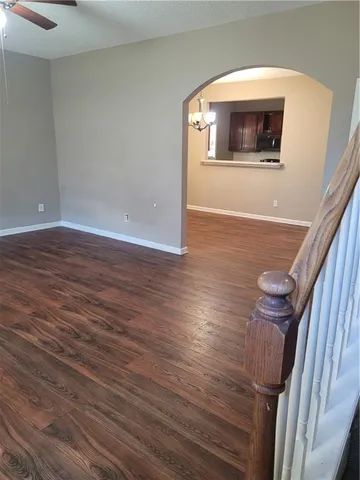 a view of hallway with wooden floor