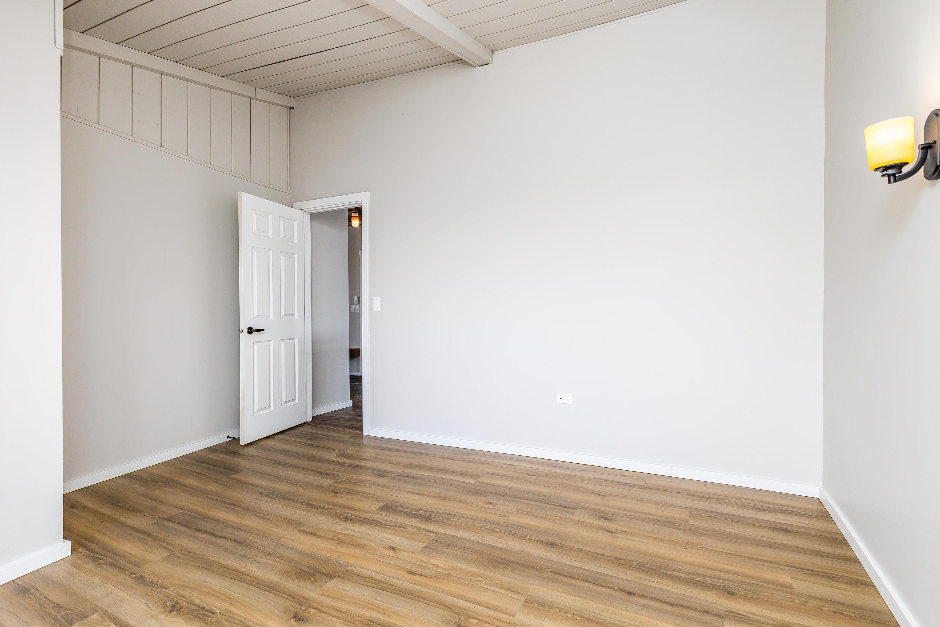 4785 South River Road Hanover, IL 61041 - Photo 18 of 46 a view of an empty room with wooden floor and a window