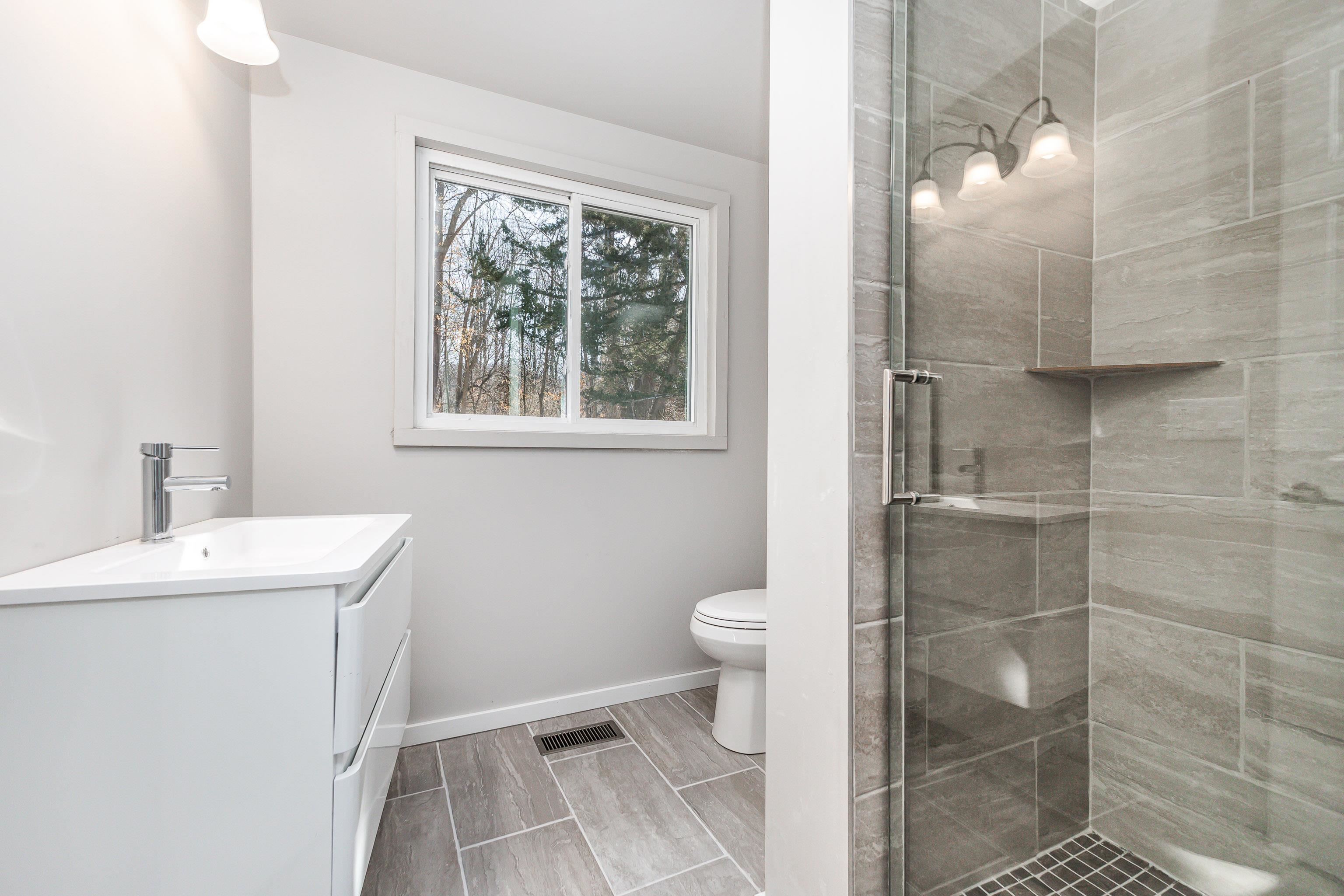 4785 South River Road Hanover, IL 61041 - Photo 21 of 46 a bathroom with a sink toilet and shower