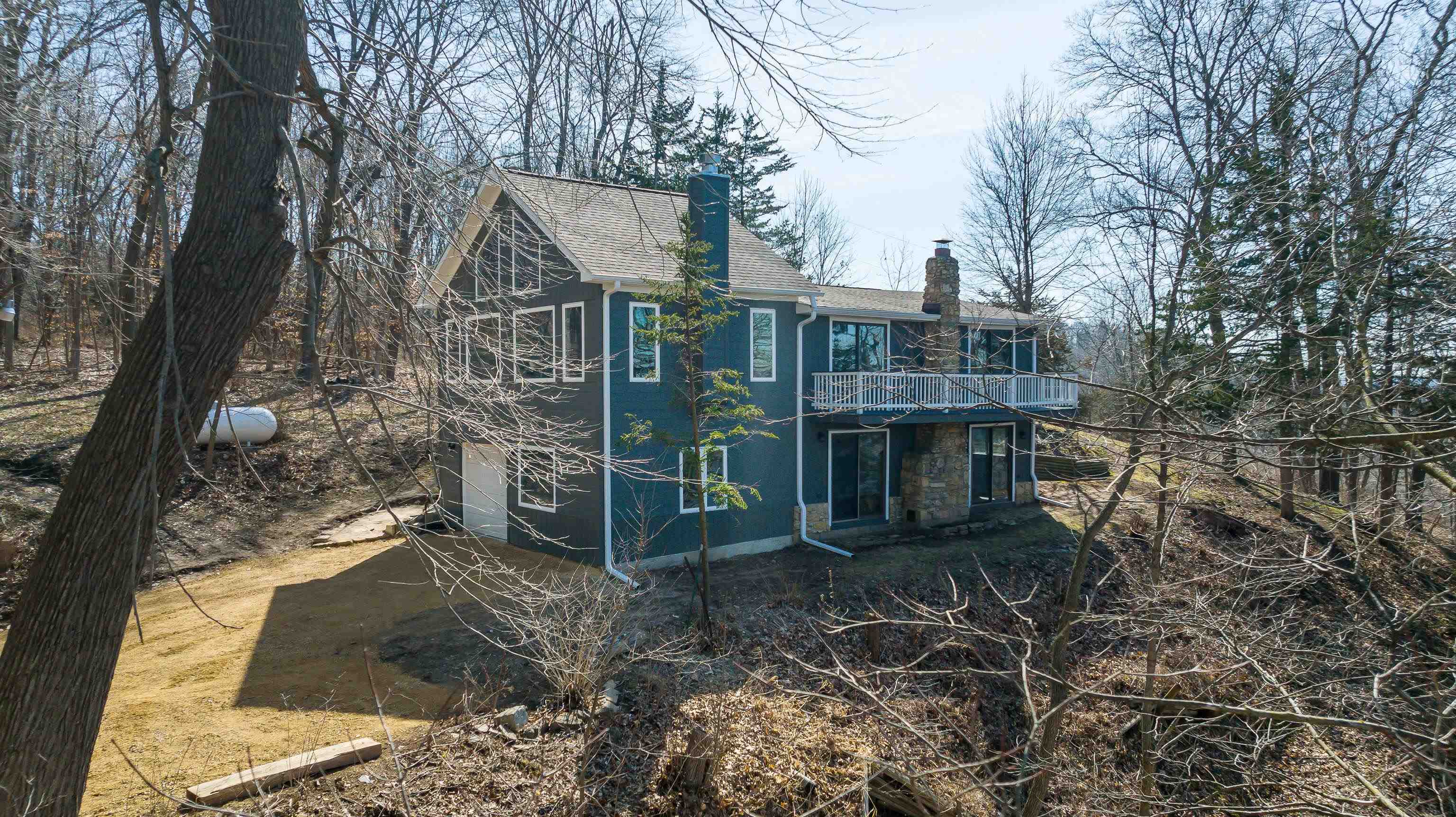 4785 South River Road Hanover, IL 61041 - Photo 3 of 46 a view of a house with a yard and large trees