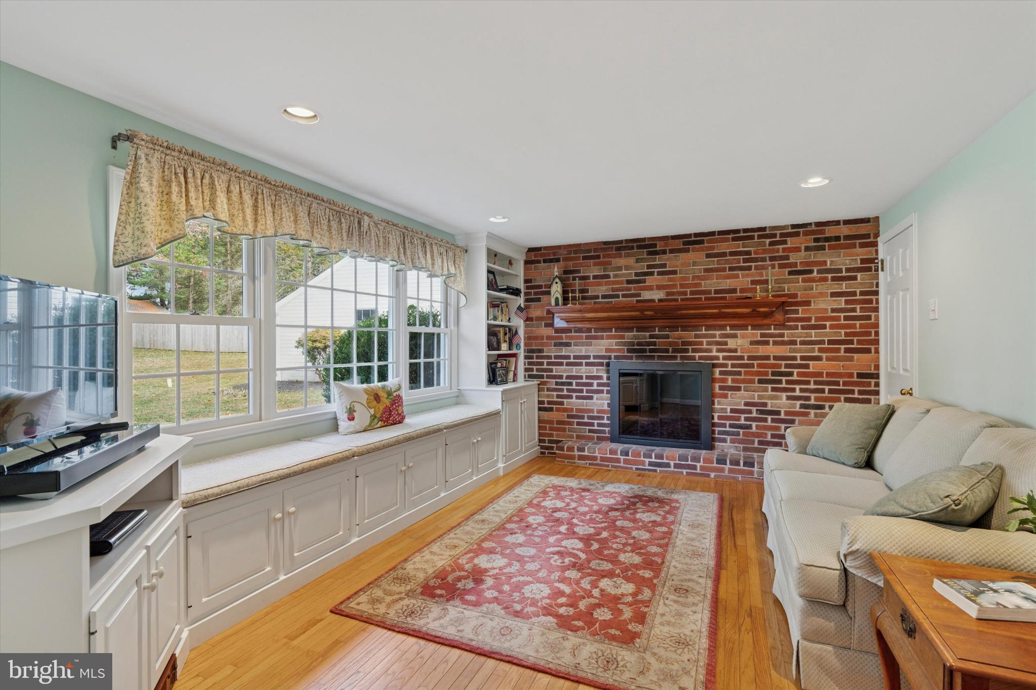 785 Mt Pleasant Road Pottstown, PA 19465 - Photo 15 of 38 a living room with furniture windows and a fireplace