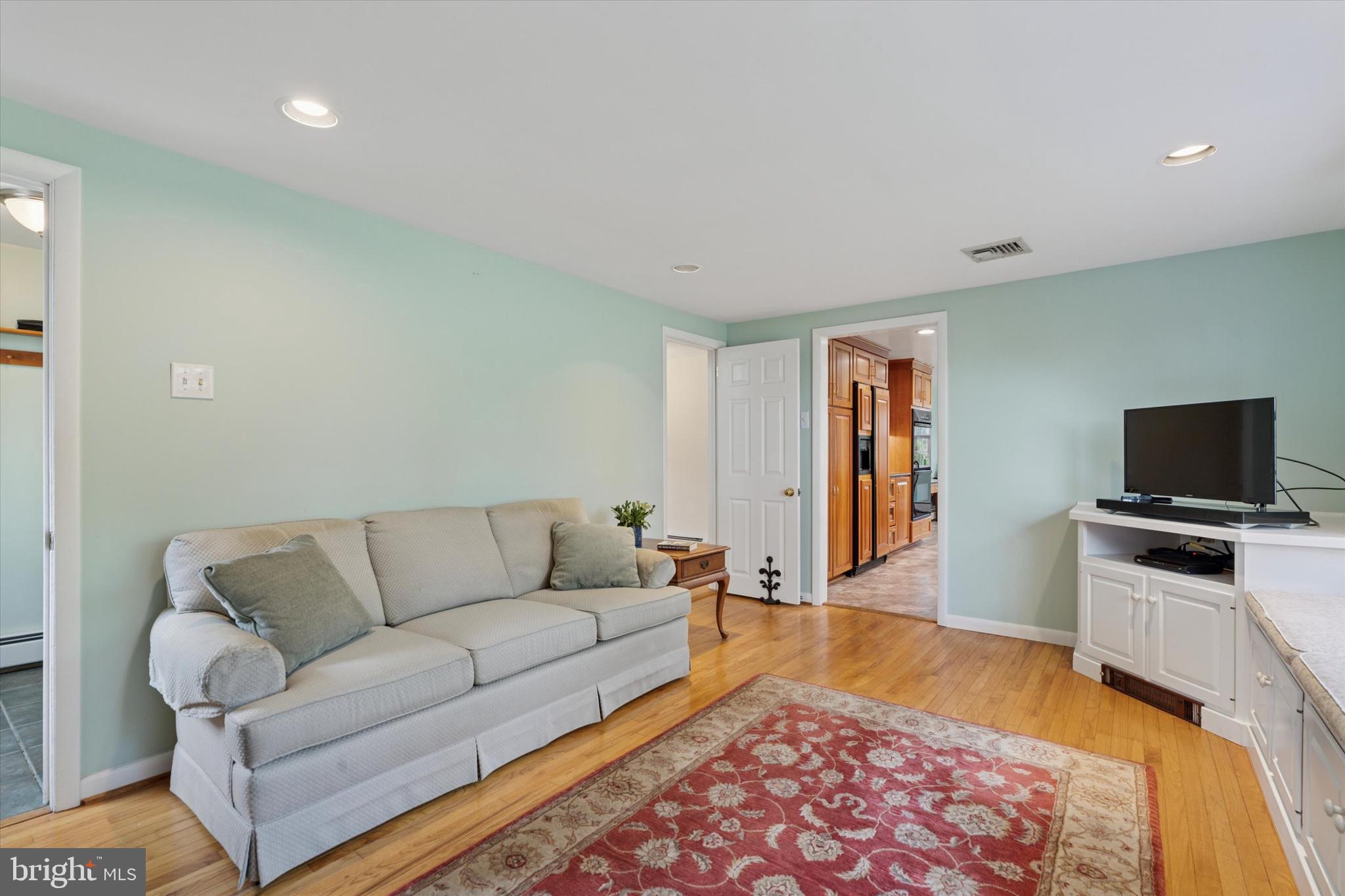 785 Mt Pleasant Road Pottstown, PA 19465 - Photo 17 of 38 a living room with furniture and a flat screen tv