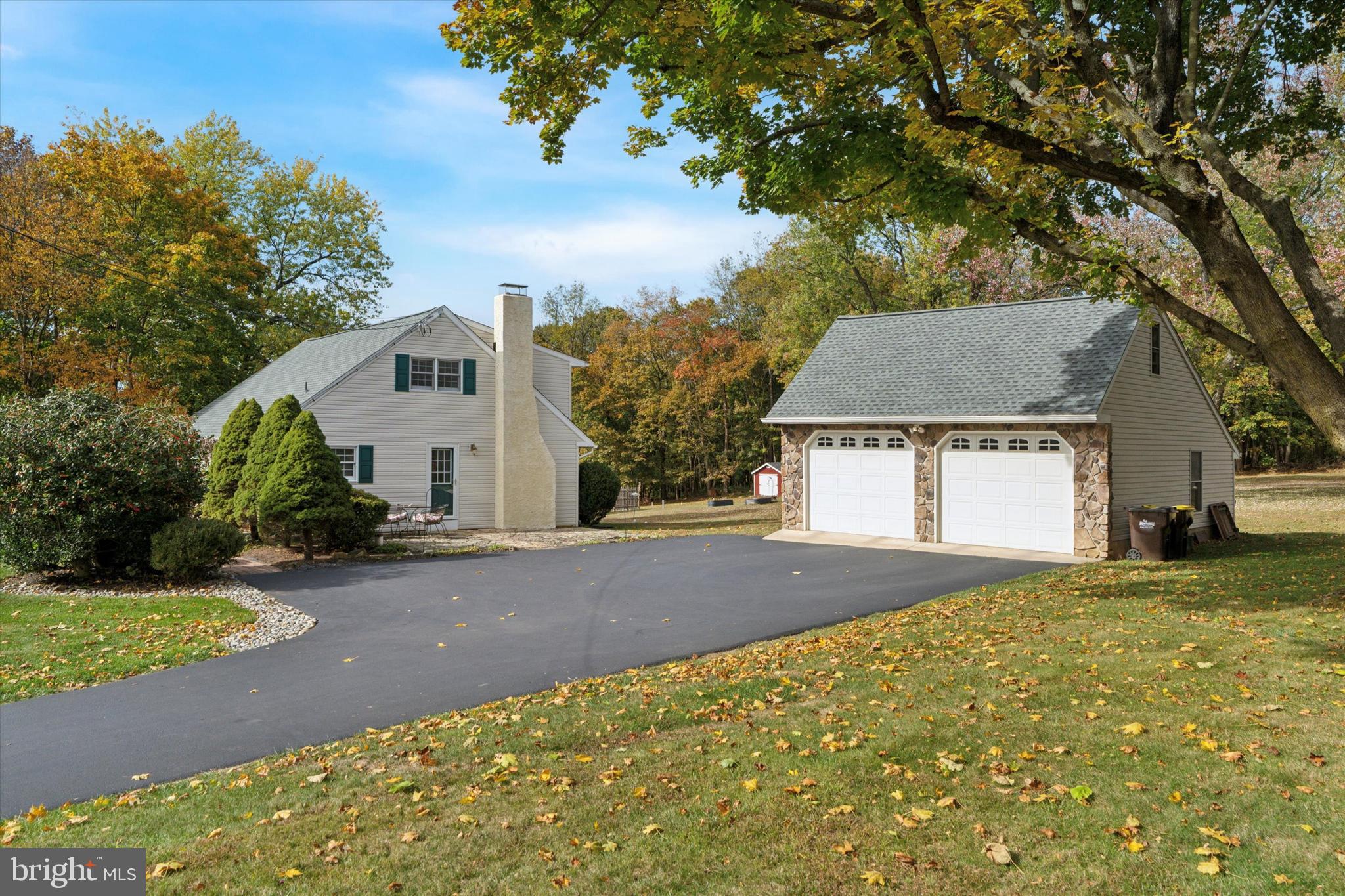 785 Mt Pleasant Road Pottstown, PA 19465 - Photo 37 of 38 a view of a house with a yard and garage