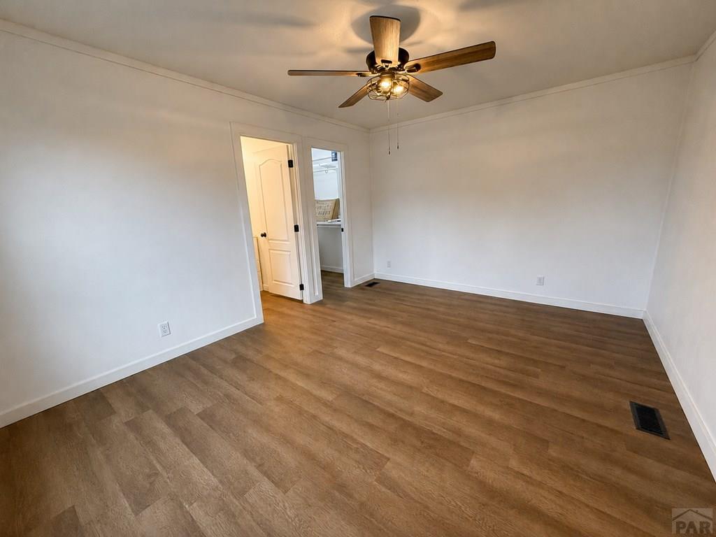6652 County Rd HH.5 Lamar, CO 81052 - Photo 13 of 22 wooden floor in an empty room