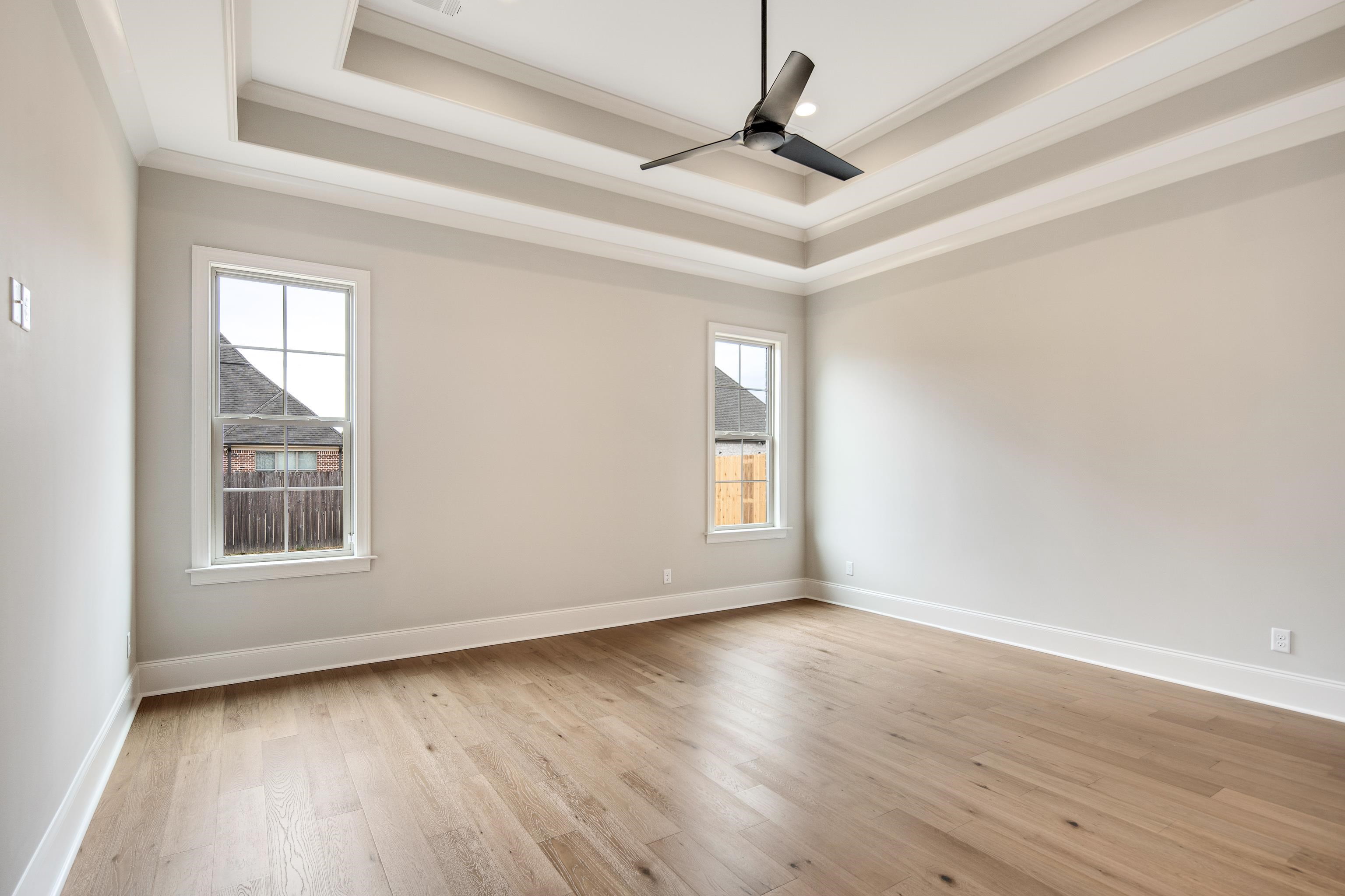 594 Cedar Shadows Circle West Collierville, TN 38017 - Photo 16 of 40 wooden floor in an empty room with a window