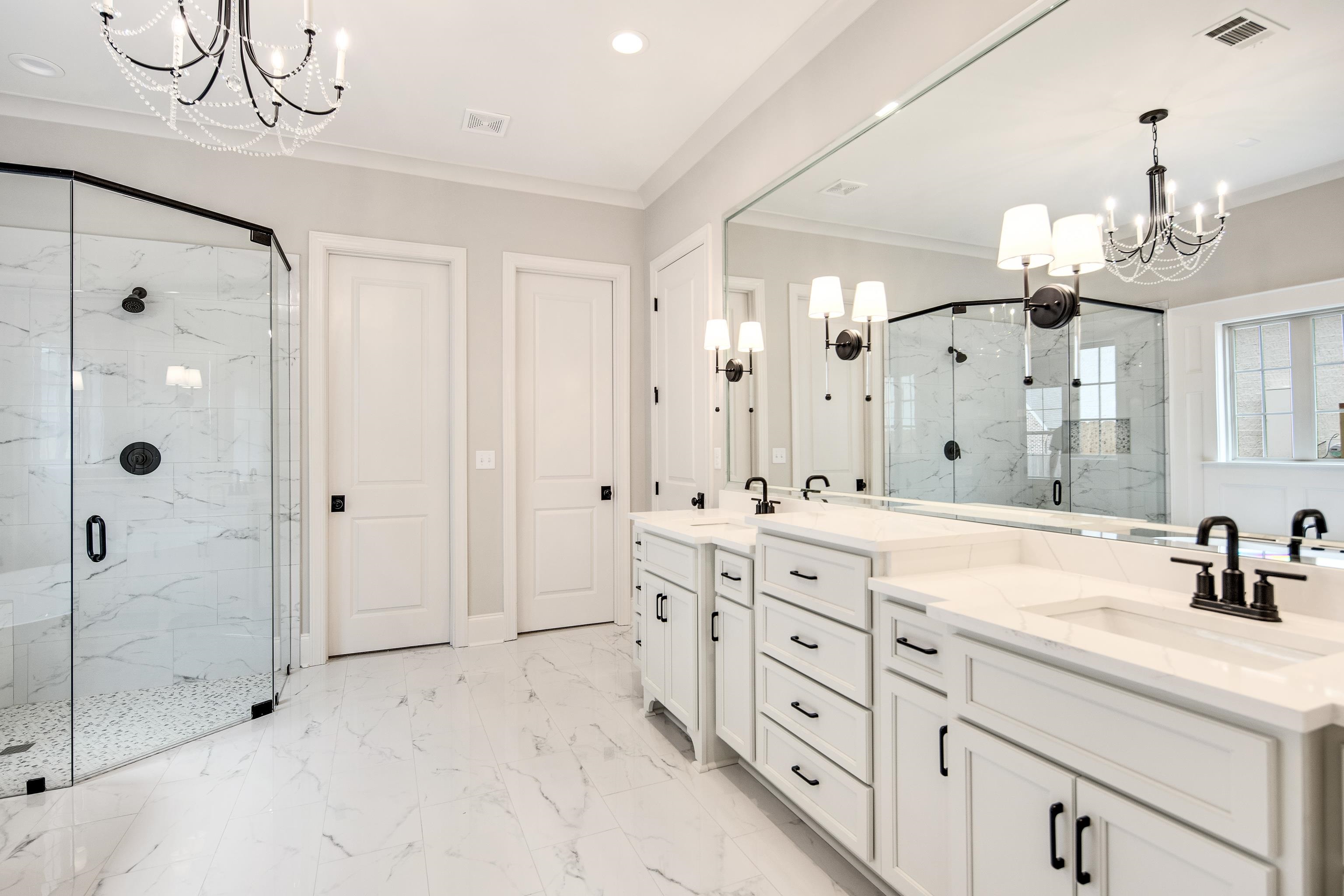 594 Cedar Shadows Circle West Collierville, TN 38017 - Photo 18 of 40 a spacious bathroom with double sink a mirror a shower and a bathtub