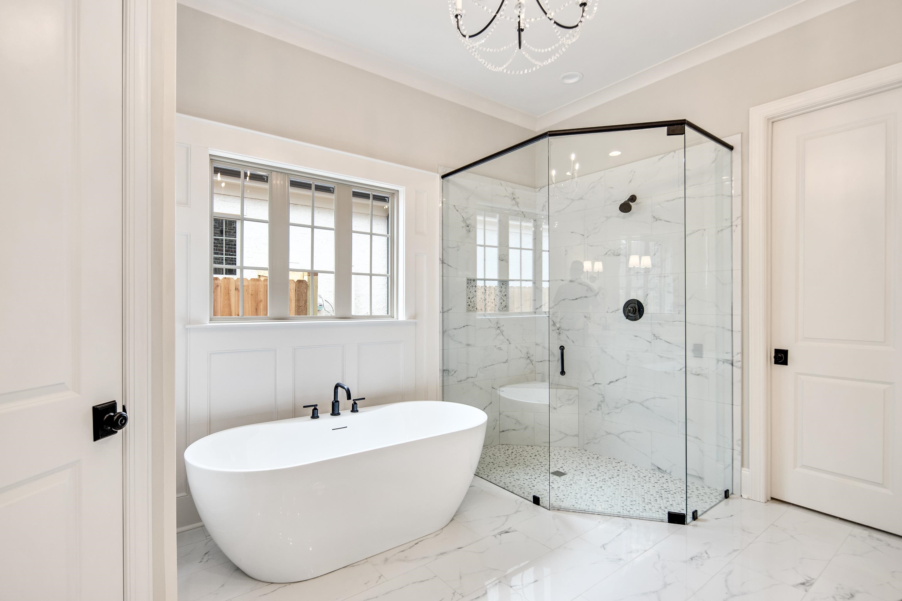 594 Cedar Shadows Circle West Collierville, TN 38017 - Photo 20 of 40 a bathroom with a white tub shower and sink
