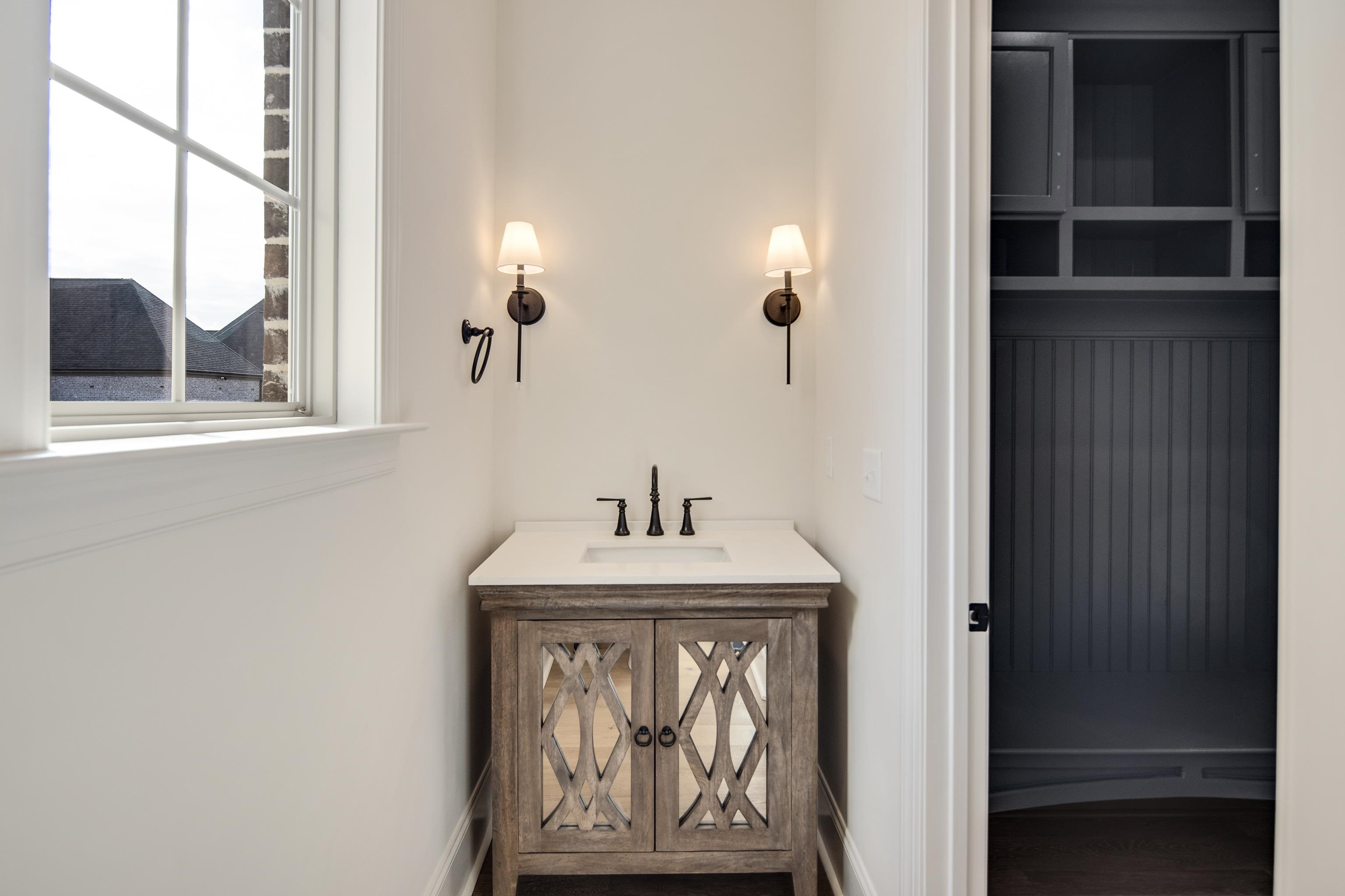 594 Cedar Shadows Circle West Collierville, TN 38017 - Photo 23 of 40 a bathroom with a sink and a mirror