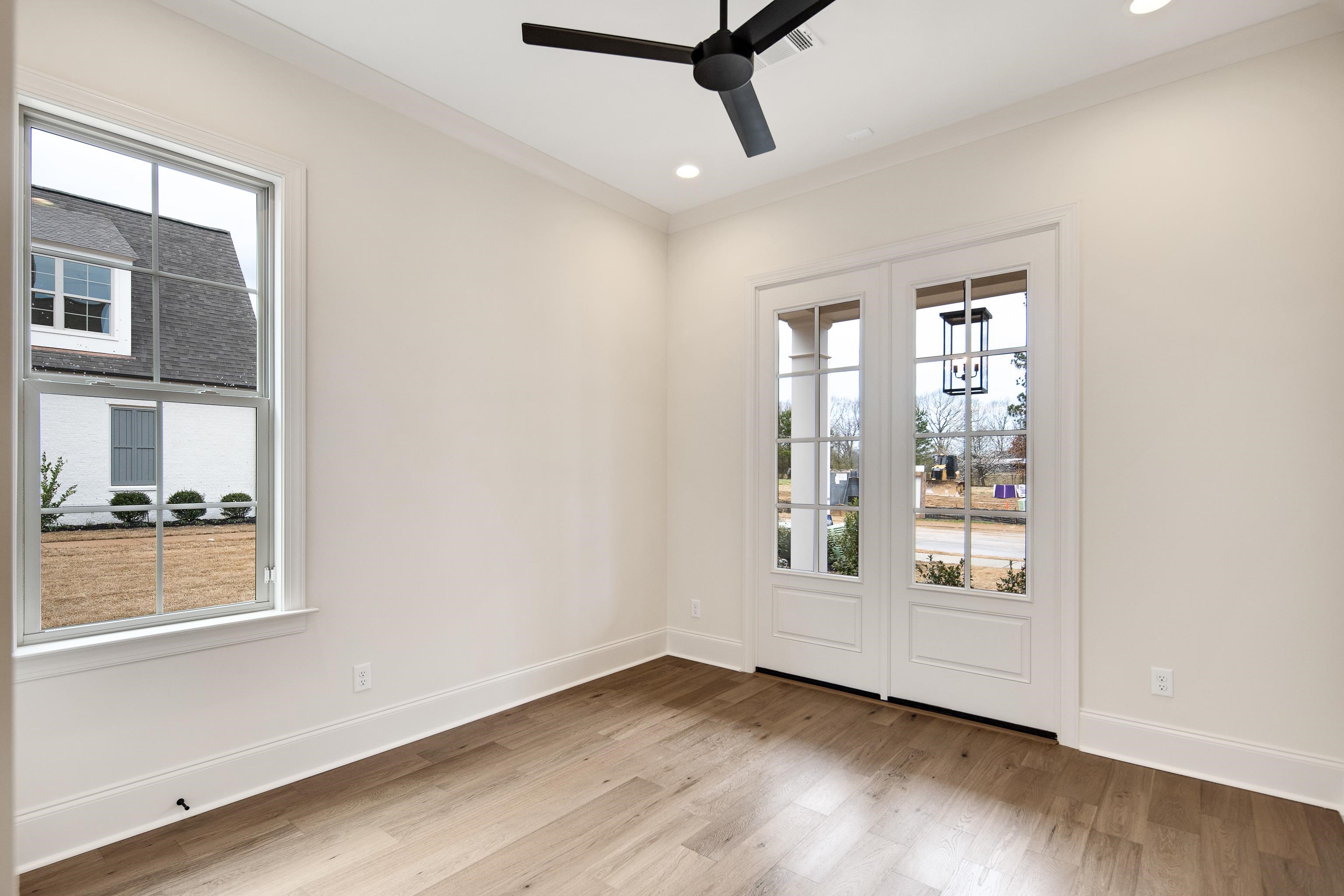 594 Cedar Shadows Circle West Collierville, TN 38017 - Photo 24 of 40 a view of an empty room with a window and wooden floor