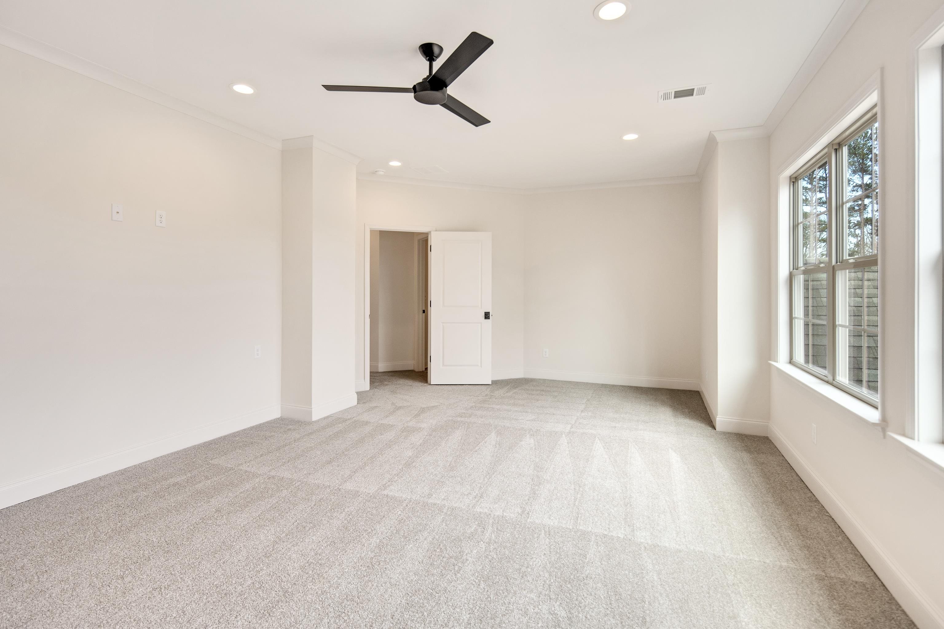 594 Cedar Shadows Circle West Collierville, TN 38017 - Photo 34 of 40 a view of a livingroom with a ceiling fan and window