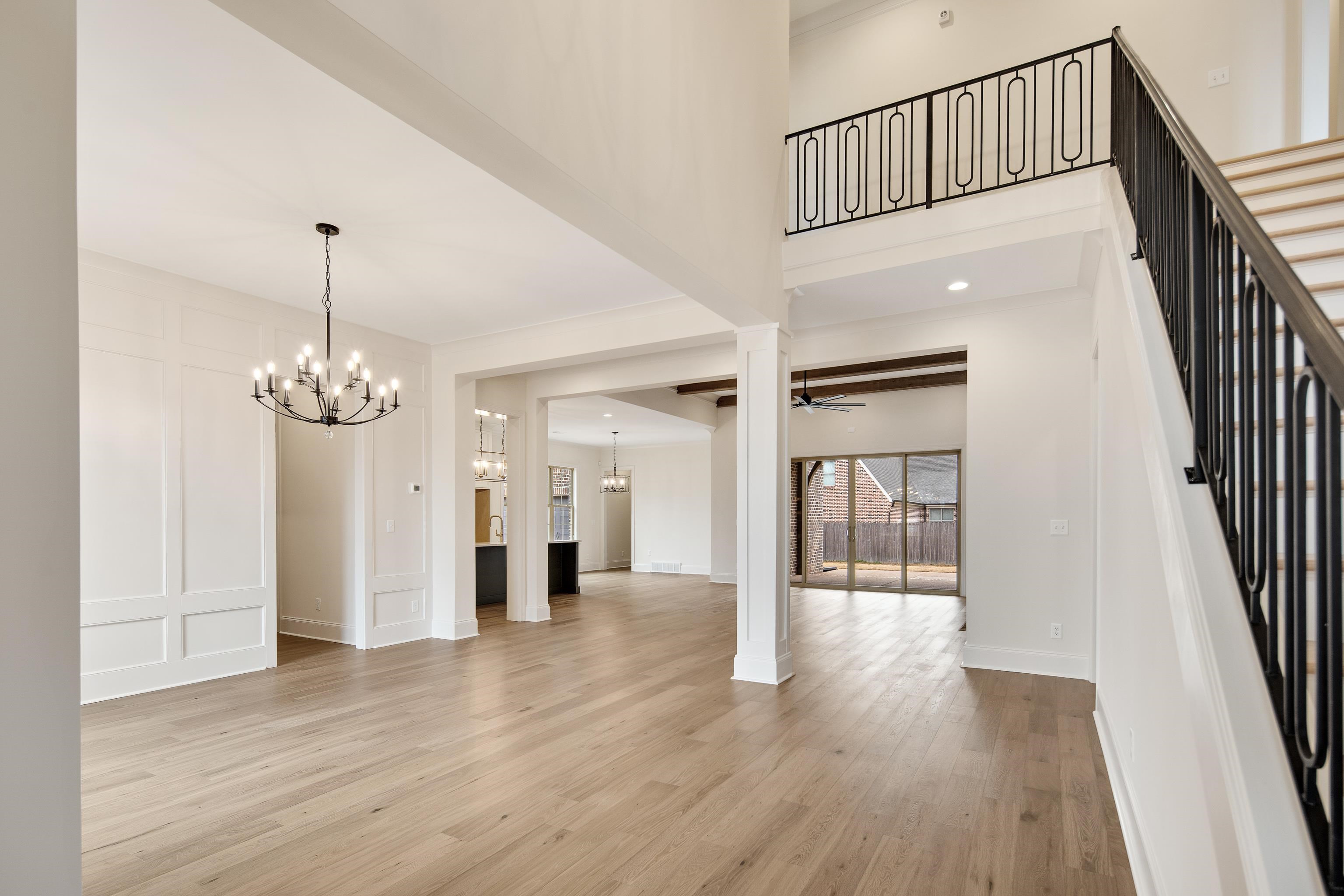 594 Cedar Shadows Circle West Collierville, TN 38017 - Photo 5 of 40 a view interior of a house with wooden floor stairs and a chandelier