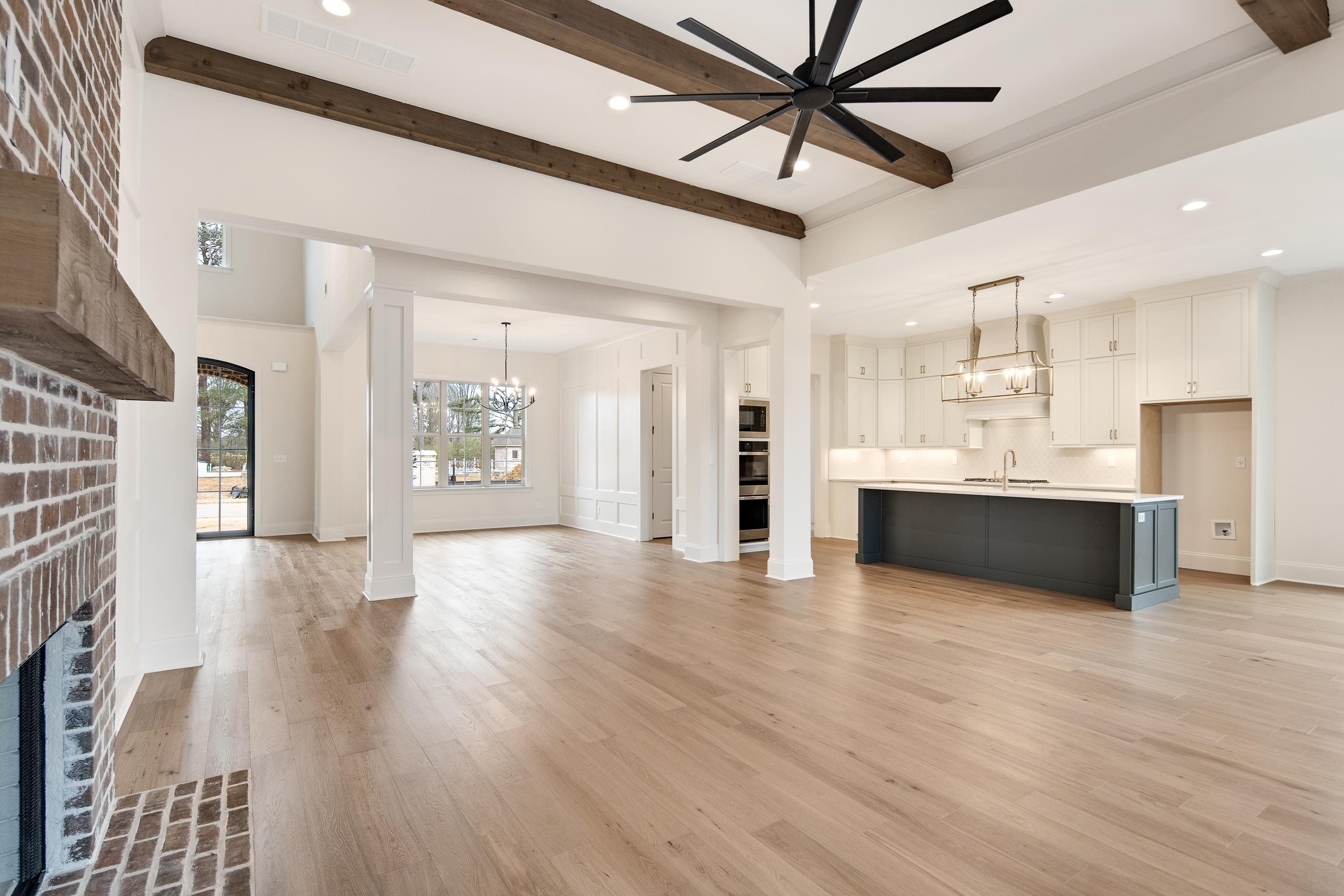594 Cedar Shadows Circle West Collierville, TN 38017 - Photo 8 of 40 a large white kitchen with a large window appliances and cabinets
