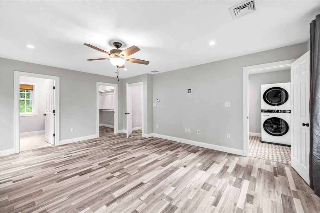 1310 North Brookfield Road Oakham, MA 01068 - Photo 21 of 30 a view of a livingroom with a dinning area wooden floor and a ceiling fan