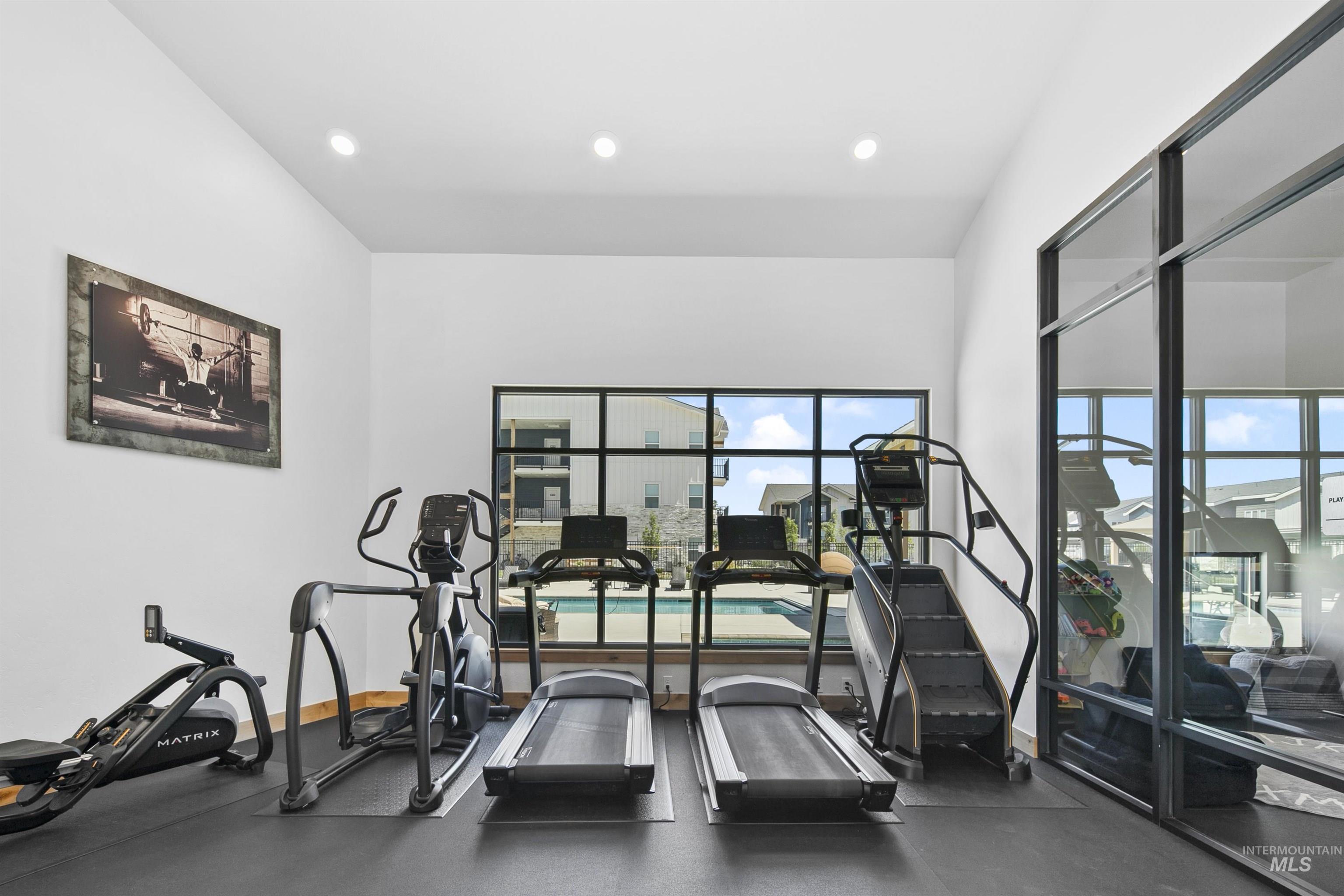 683 West Wrangler Street Meridian, ID 83646 - Photo 21 of 23 Dedicated fitness space with recessed lighting, large windows, rubber flooring, and a mirrored wall